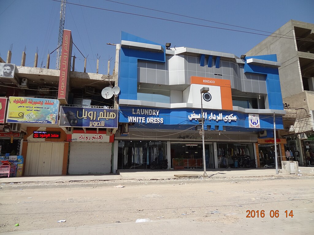 مكوى الرداء الابيض - شركات تنظيف في الأنبار